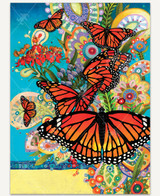  Monarch Madness wooden jigsaw puzzle displays a group of monarch butterflies perched on flowers and fluttering around. Some flowers are decorated with colorful paisley designs that stand out against the bright teal background. 