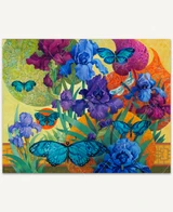  Iris Garden wooden jigsaw puzzle displays vibrant purple and blue iris flowers in a garden with blue butterflies and a dragonfly flying around them. The bright orange sun and patterned leaf shapes fill the background. 