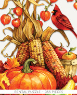  Close-up of Fall Colors wooden jigsaw puzzle presenting a gathering of harvested fruit and vegetables. A pumpkin and gourds sit in front of three corn cobs, leaning against a basket of apples. A cardinal sits above the basket on a corn husk. Colorful leaves decorate this autumn arrangement. 