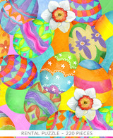  Close-up of Tossed Eggs wooden jigsaw puzzle featuring vibrant pile of Easter eggs, all with different colors and patterns. Three daffodils are scattered within the eggs, adding to the spring feel. 
