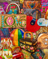  Close up of a vibrant collection of handbags, including woven totes, embroidered clutches, and beaded purses in various colors, shapes, and styles. 