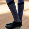 Navy slick boot socks with constellation and horse pattern worn under riding boots