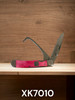 Twisted X pink hoof pick and serrated folding knife tool for horse care and ranch use on wooden background