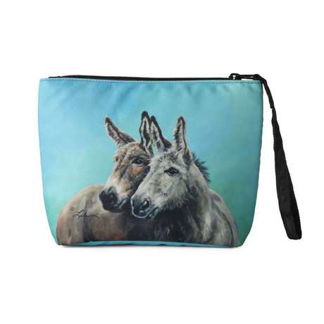 Accessory bag featuring illustrated donkey friends on a blue background with zipper closure and wrist strap