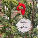 Merry and Married ornament with a red ribbon on a tree