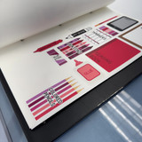 Pink and Purple You Will Need school supply whiteboard clings stored on a Binder Ready sheet in a three-ring binder
