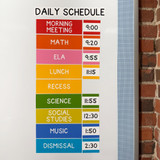 Bright Minds daily schedule clings with times on a classroom whiteboard