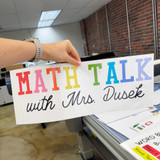 Bright Minds Math Talk cling personalized with a teacher's name, held up to show the static cling