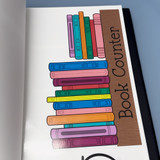 Rainbow classroom book counter clings held up to show the reusable static cling