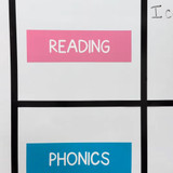 Whiteboard cling dividers framing Reading and Phonics subject clings