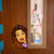 Bitmoji decal peeking around a classroom door window