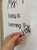 Hand applying personalized Today Is and Learning Target clings to a whiteboard