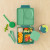 Green OmieSnack with a packed green OmieBox and OmiePod