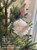Engaged acrylic ornament with a blush ribbon and its sample choices