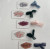 Personalized acrylic name tags with brushstroke backgrounds and ribbons