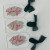 Acrylic stocking tags with script names and green ribbons
