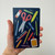 School Supplies Pocket Moleskine held in one hand to show its size