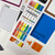 Rainbow You Will Need school supply whiteboard clings stored on a Binder Ready sheet in a three-ring binder