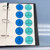 Blue and Green Parts of Speech whiteboard clings stored on a Binder Ready sheet in a three-ring binder