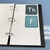 Earth Tones Weekly Focus Monday through Friday whiteboard clings stored on a Binder Ready sheet in a three-ring binder