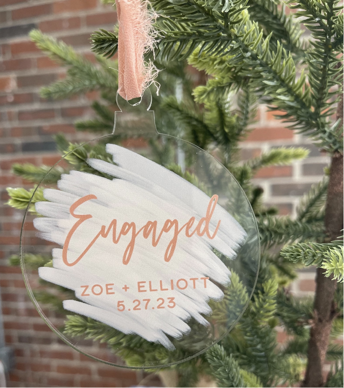 Engaged acrylic ornament with the couple's names and date in coral
