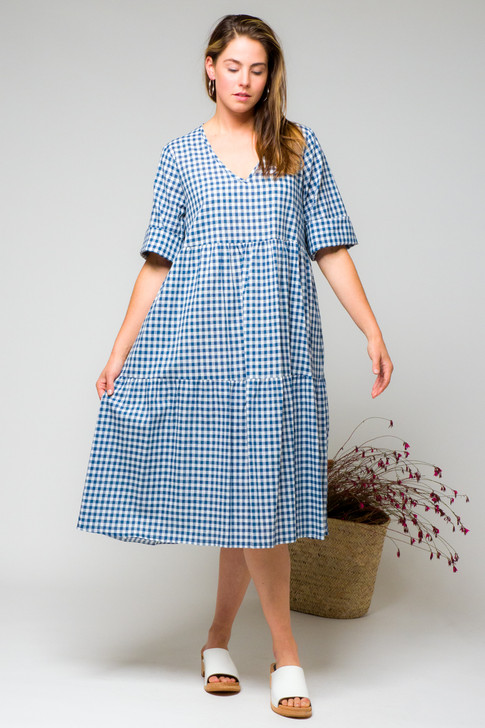 A tiered, v-neck dress with a relaxed, off the body fit features three quarter sleeves, side seam pockets and over the knee length. Wear it loose and free or cinched at the waist with the obi belt in same or contrasting gingham. 

The layered dress can be styled with the wrap around jacket, cinched at the waist or relaxed and loose. Layer the dress with a skivvy, leggings and cardigan on top and cinch with your favourite belt or obi belt. Add your shoes - short boots, sneakers or slides for versatile wardrobe looks. Model is size 10, 176 tall and is wearing XS.
Available in a cotton navy colourway.

Made in Melbourne, Australia, naturally and ethically.