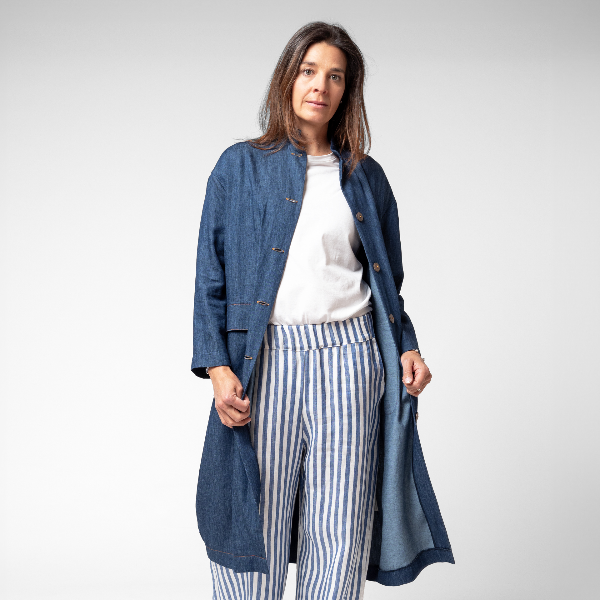 Photo of model wearing our Oko Duster in Denim Blue. Ideal for effortless layering throughout the cooler months, it's made in Australia from a premium quality organic cotton/hemp blend with a denim weave.