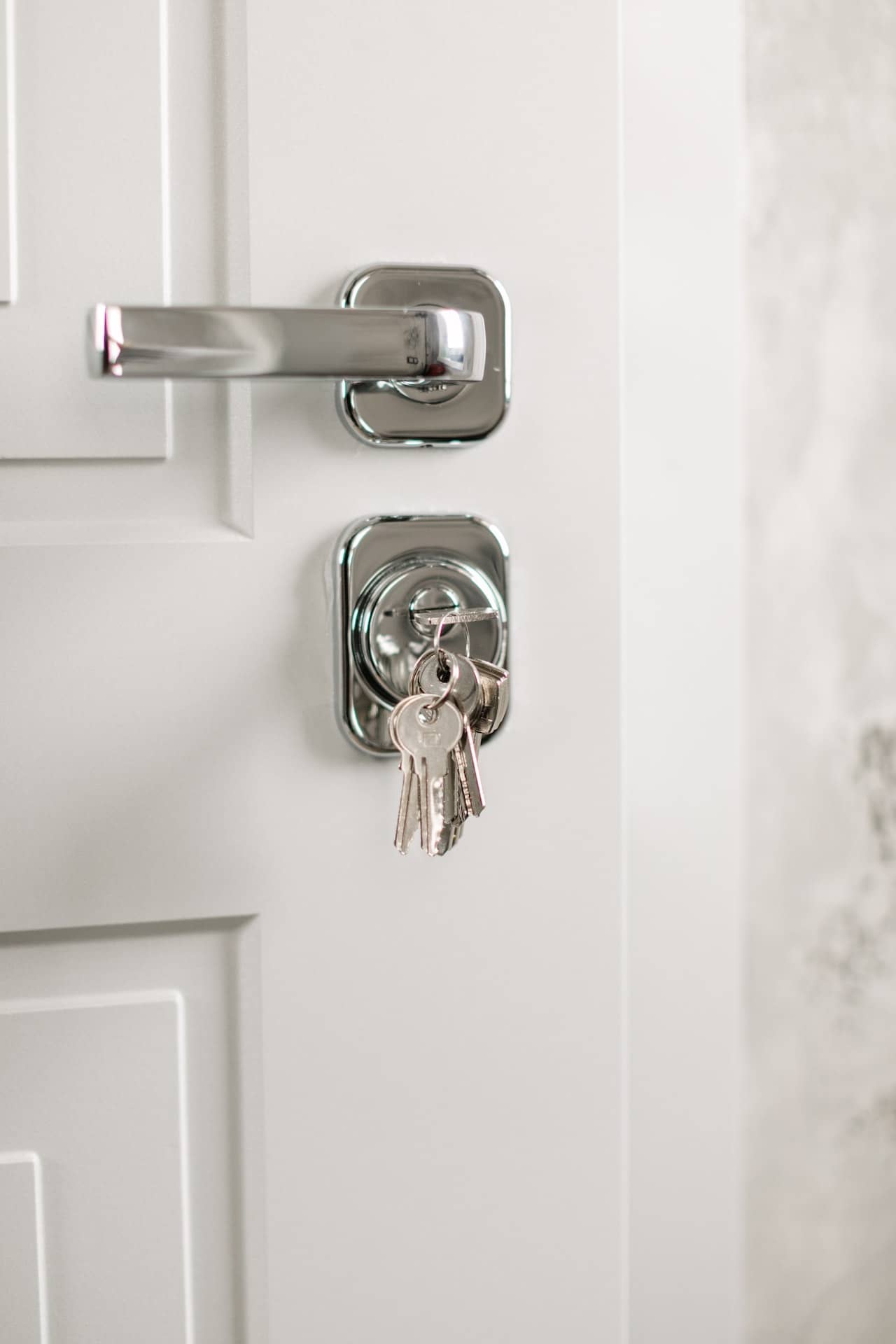 key inserted into the lock of a door