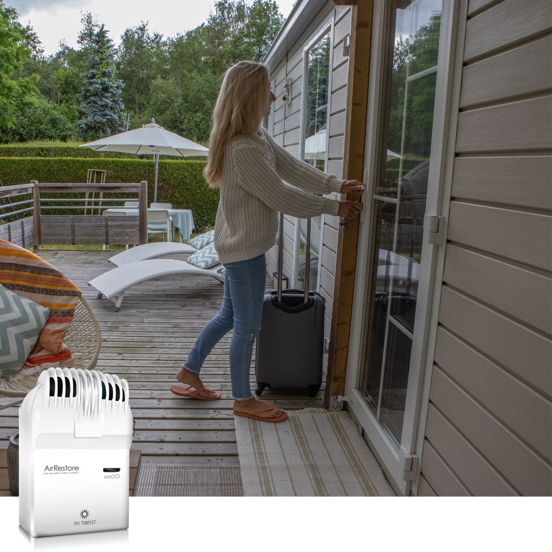 woman entering vacation rental - air purifier, naturalizer, AirRestore