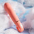 Buy the Aria Smokin' AF 10-function Silicone Vibrator with Finger Ring in Coral - Blush Novelties