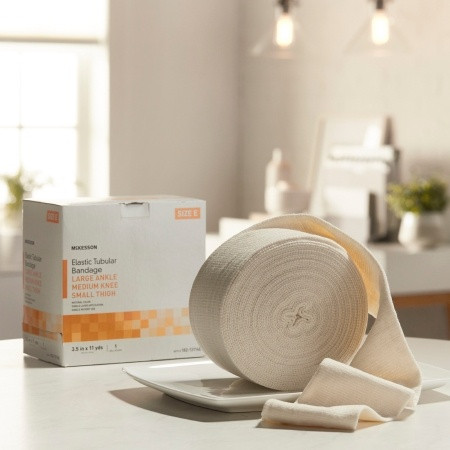 Elastic Tubular Support Bandage McKesson Spandagrip™ 3-1/2 Inch X 11 Yard Large Ankle / Medium Knee Pull On Natural NonSterile Size E Standard Compression in home setting