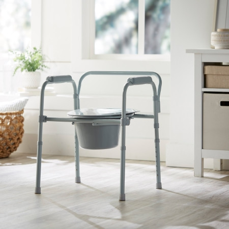 McKesson Folding Steel Frame Commode in home setting