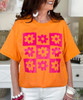checkerboard flower tee orange close up