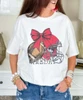 game day football with customized helmet bow tee close up