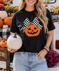 jack o lantern with checkerboard bow graphic shirt model image close up