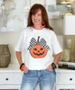 jack o lantern with checkerboard bow tee