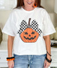 jack o lantern with checkerboard bow tee close up