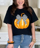 pumpkin with checkered bow tee close up