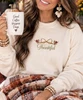embroidered thankful bow with trukeys sweatshirt model image close up