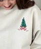 embroidered christmas tree with ribbon sweatshirt close up of design