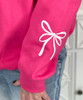 monogrammed white bow with bow on sleeve sweatshirt close up of sleeve
