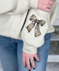 monogrammed camo bow with bow on sleeve sweatshirt close up of sleeve