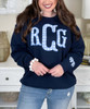 light blue gingham fishtail monogram with bow on sleeve sweatshirt close up