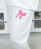 pink checkered monogram bow sweatshirt and sweatpant set close up of bow on sweatpants