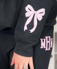 light pink gingham fishtail monogram sweatshirt and sweatpant set close up of bow on sleeve
