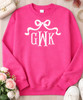 bow with fishtail monogram sweatshirt flat lay heliconia