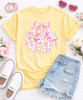 Girls comfort colors pink bow monogram graphic tee flat lay