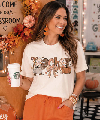 teacher with pumpkins and bow tee model image