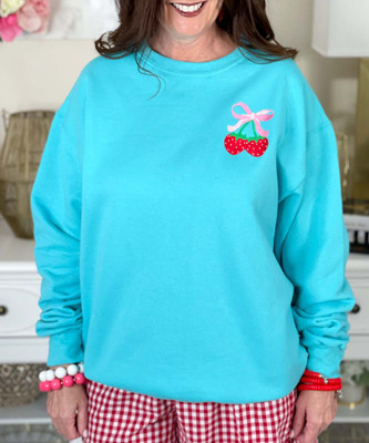 embroidered strawberries with bow sweatshirt close up