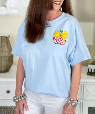 pocket checkerboard apple with pencil bow tee close up